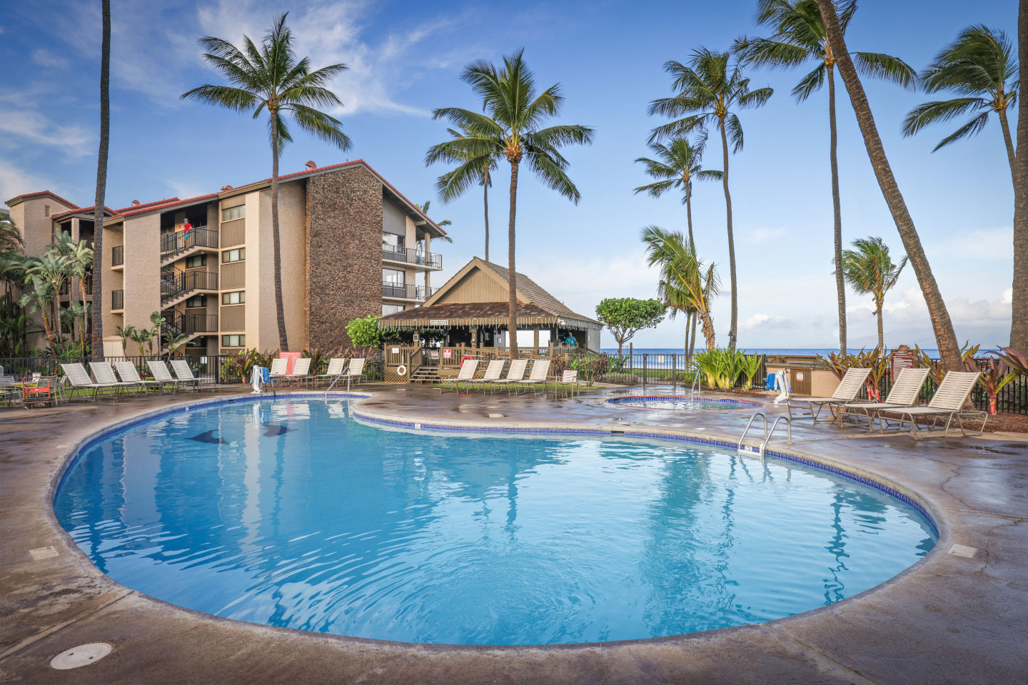 Resort pool and ocean in background.