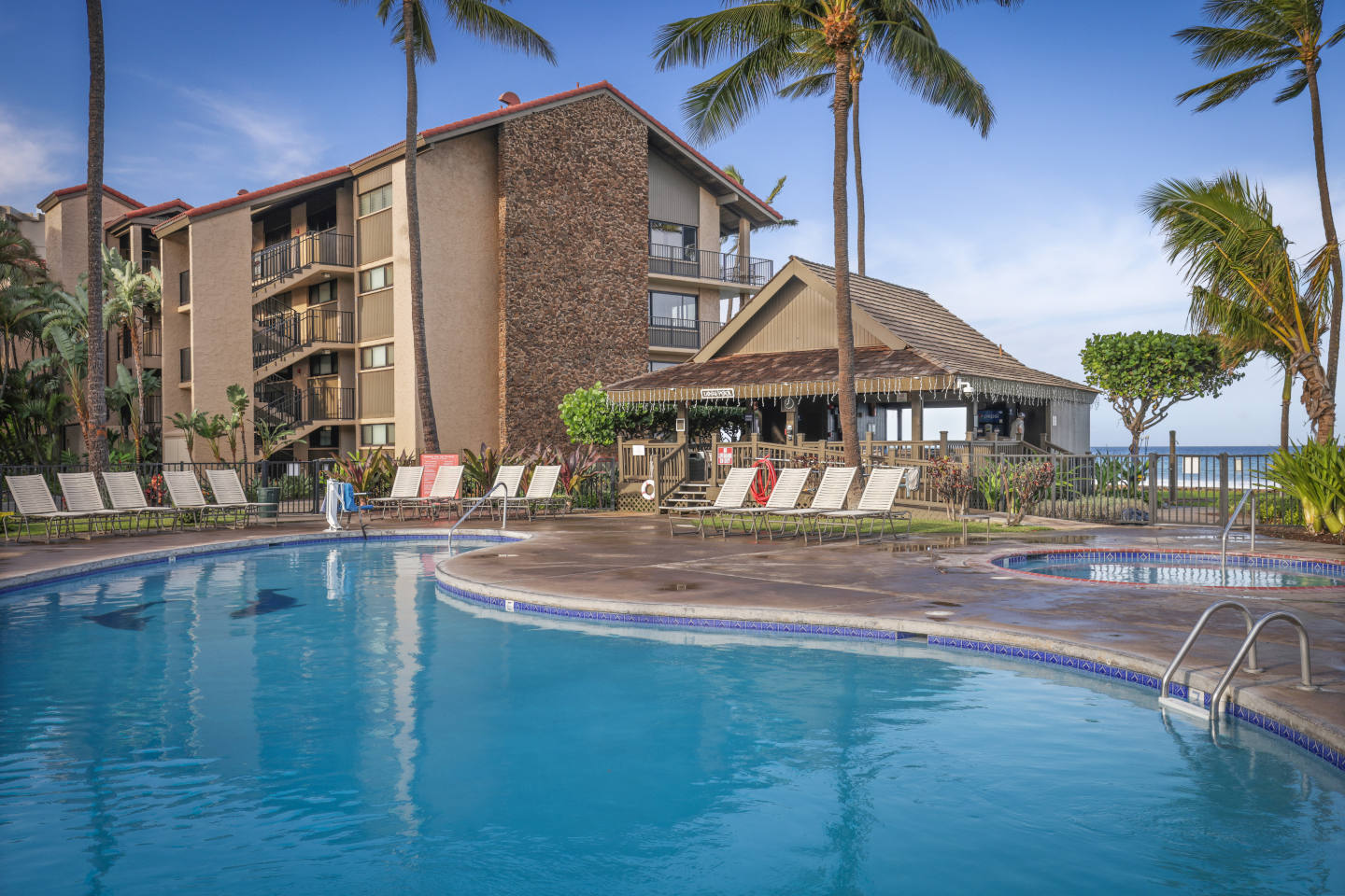 Swimming Pool, lounge chairs and poolside pavillion