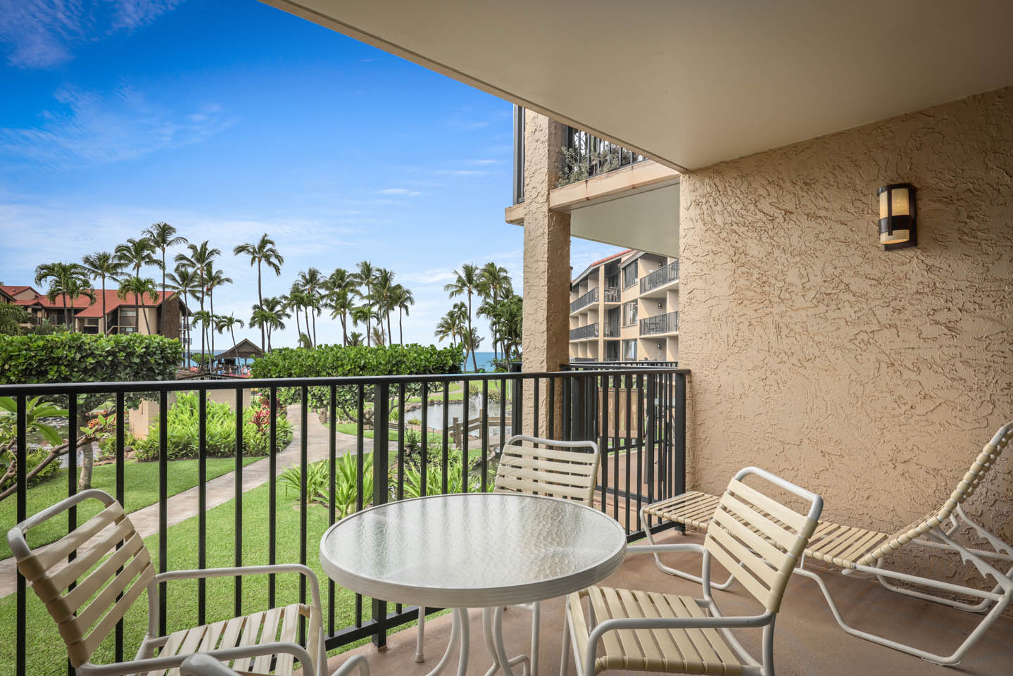 Balcony with table and chairs.