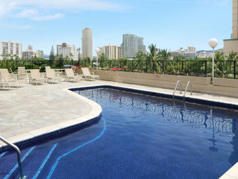 Aqua Palms Waikiki Pool deck with lounge chairs