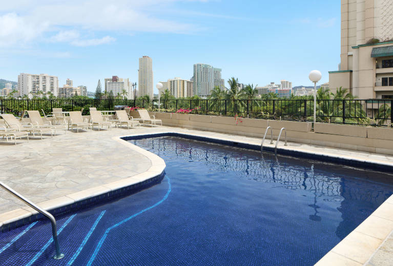 Aqua Palms Waikiki Pool deck with lounge chairs 