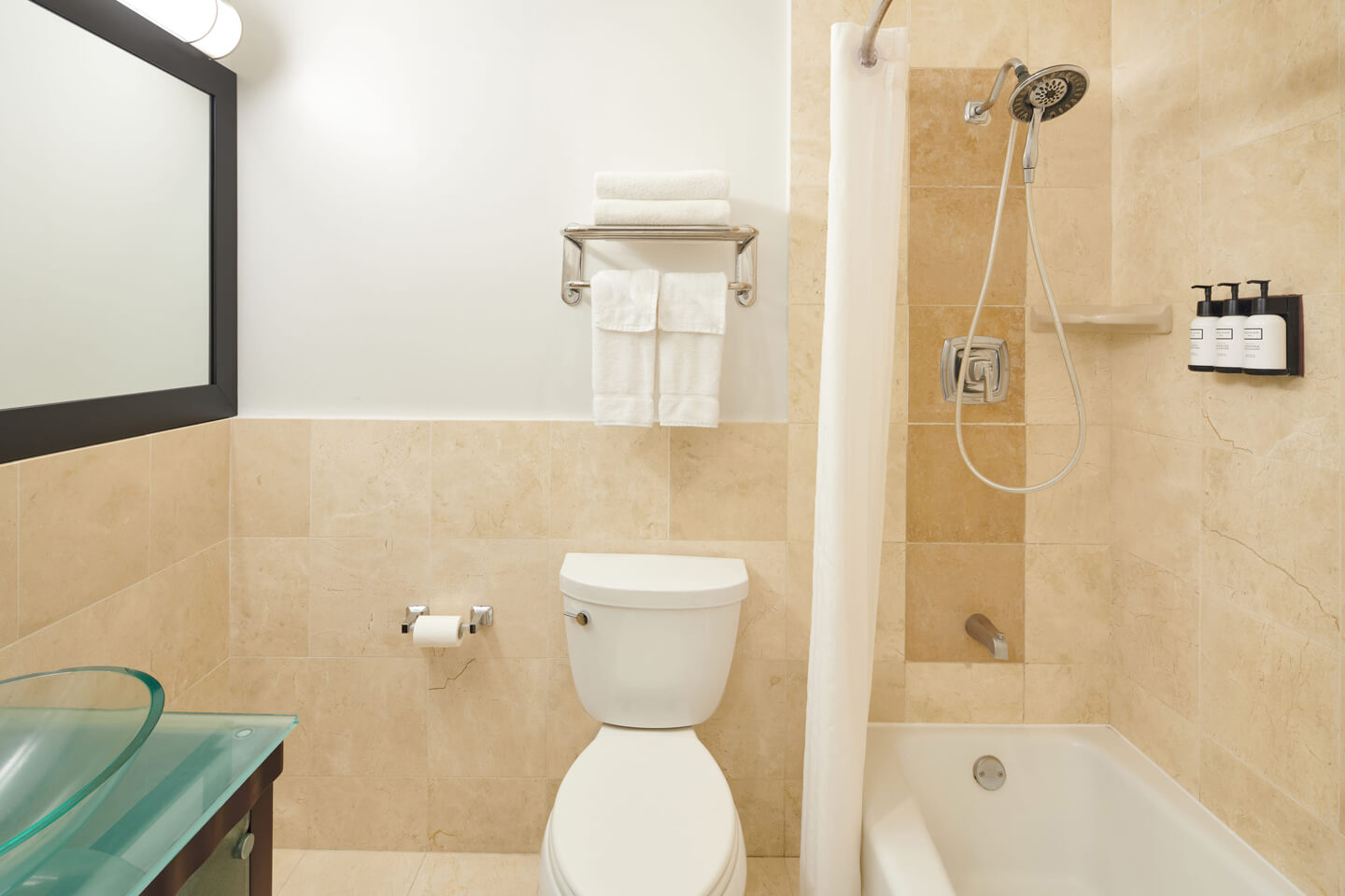 Bathroom with a sink, toilet, shower and tub.