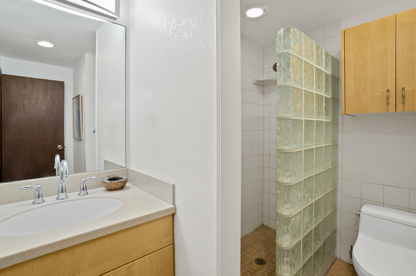 Bathroom with sink, shower, toilet.