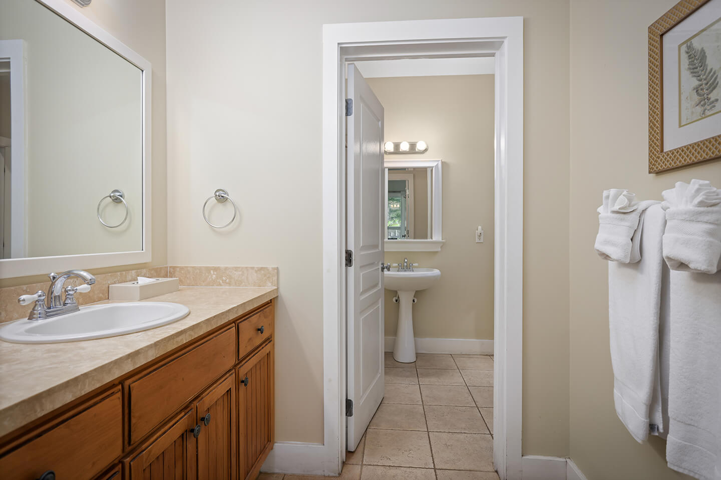 Baathroom with counter, 2 sinks.