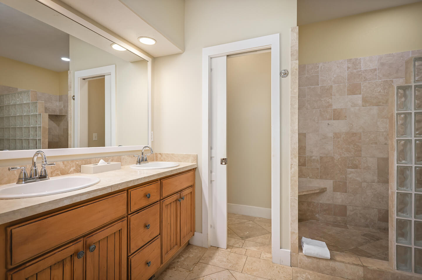 Bathroom with sink, counters, shower.
