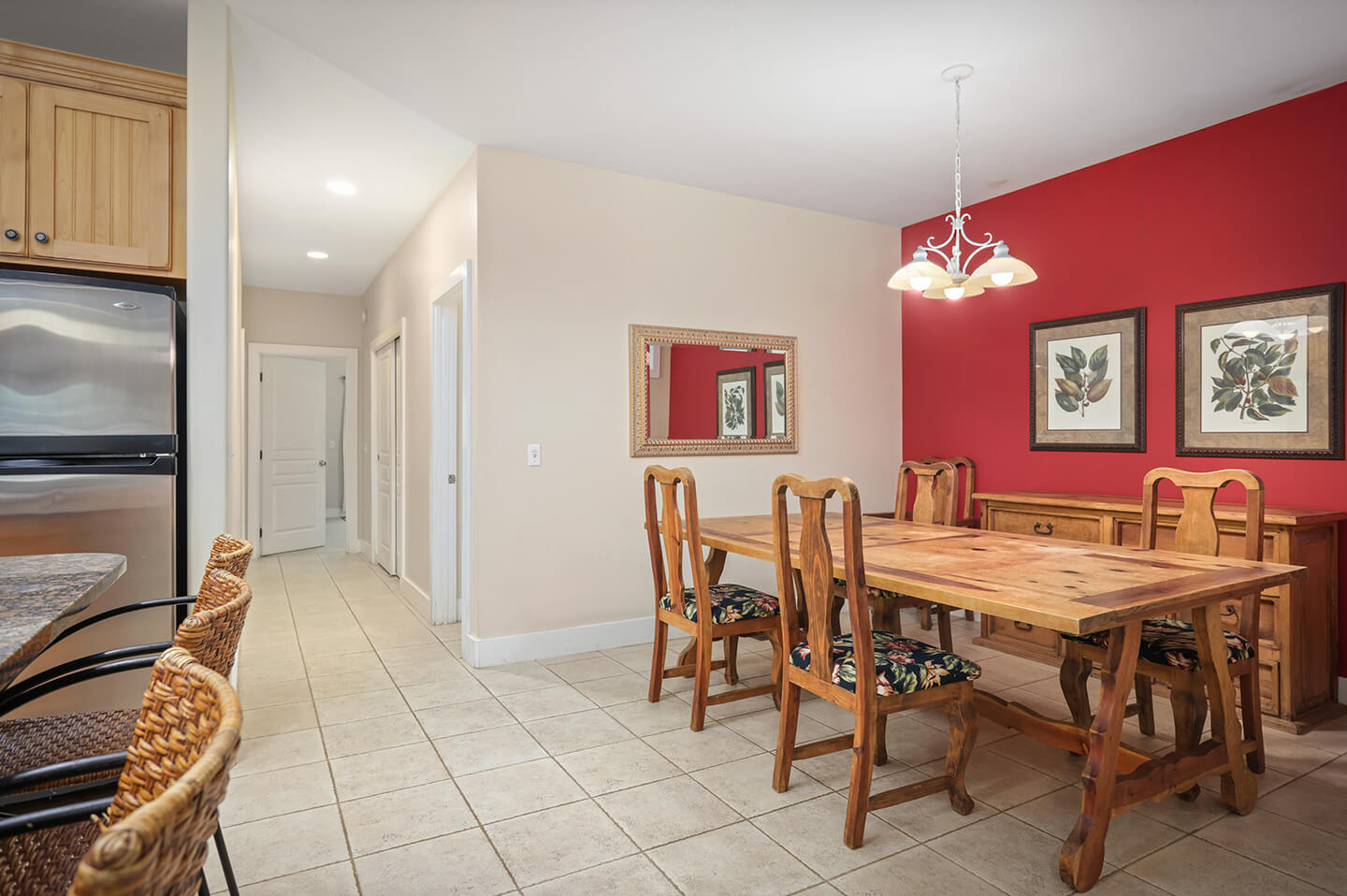Dining area with large table and chairs.