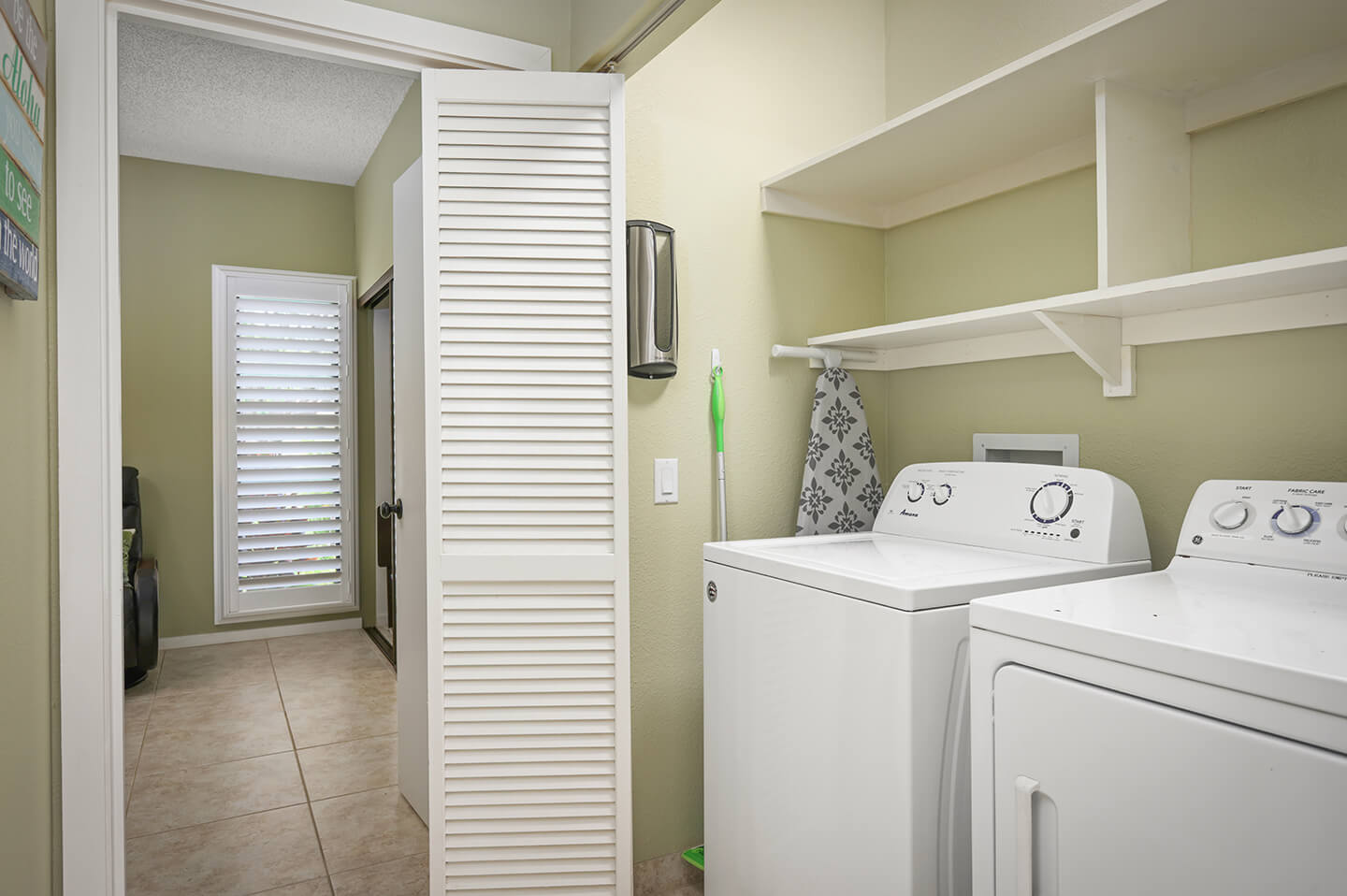 Closet with washer and dryer.
