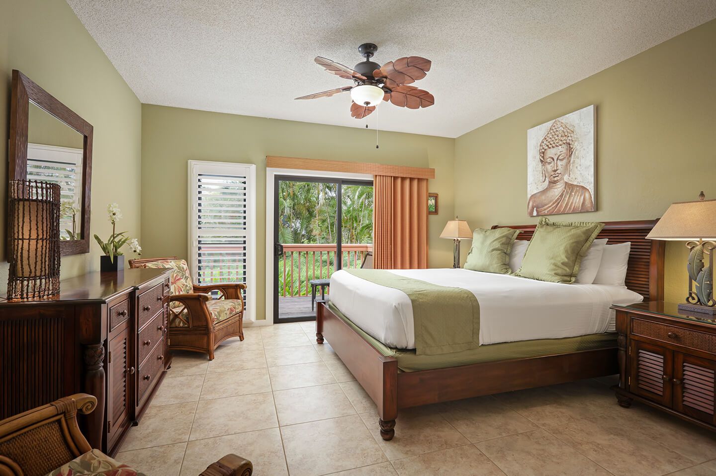 Room with bed, dresser, night stand, lamps, balcony.