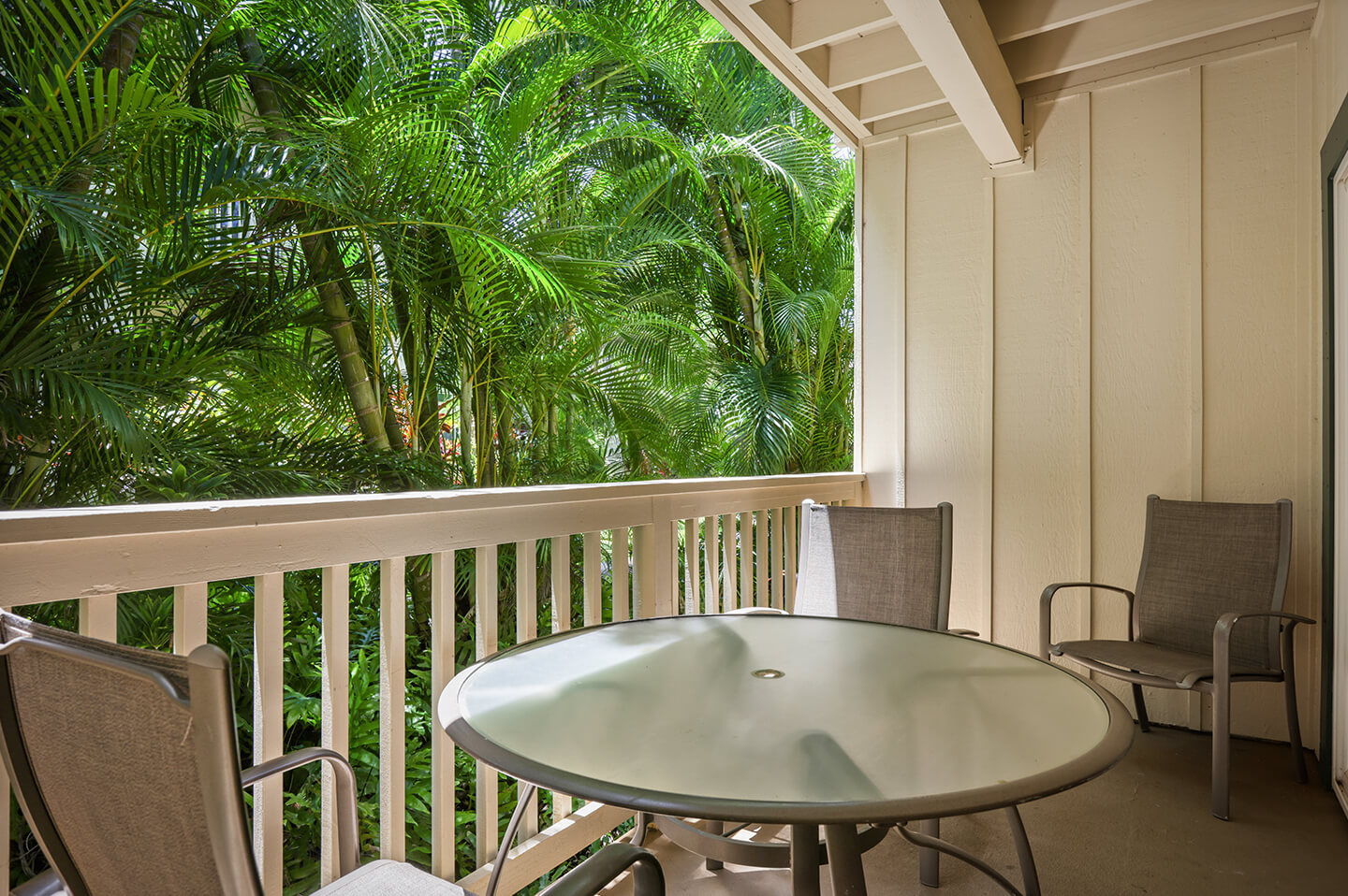 Balcony with table and chairs.
