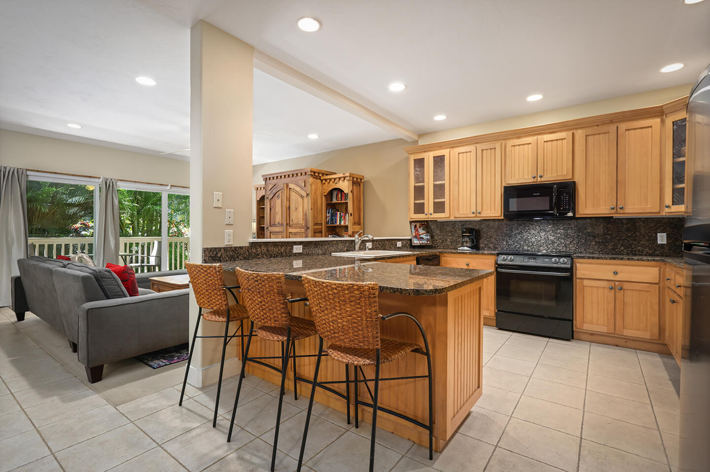 Kitchen with counter top dining area and chairs.