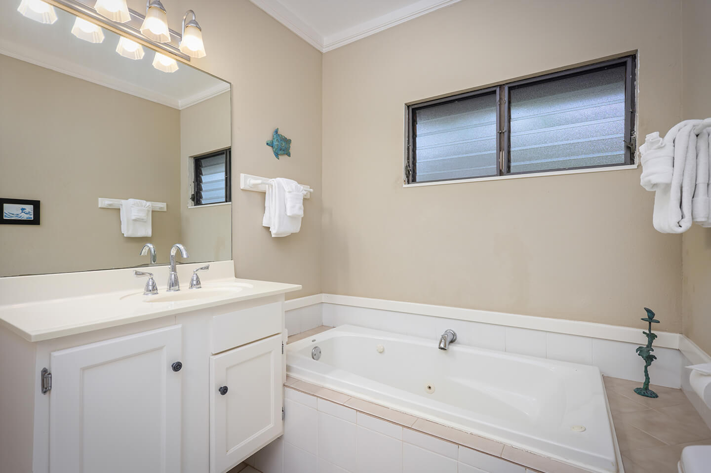 Bathroom with sink and deep soak tub.