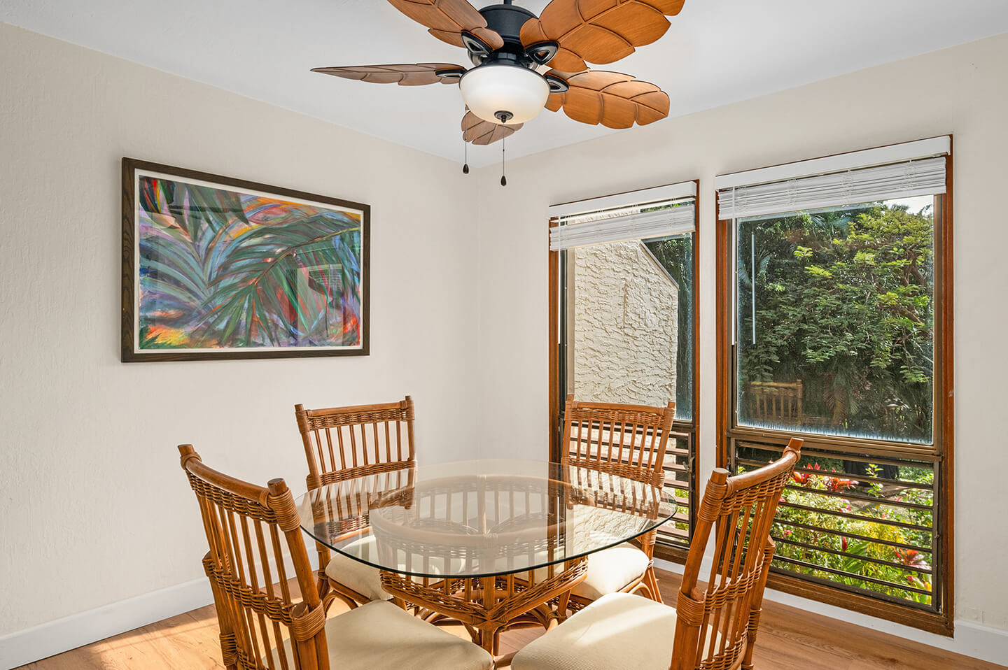Dining dable, chairs, large picture window with garden views.