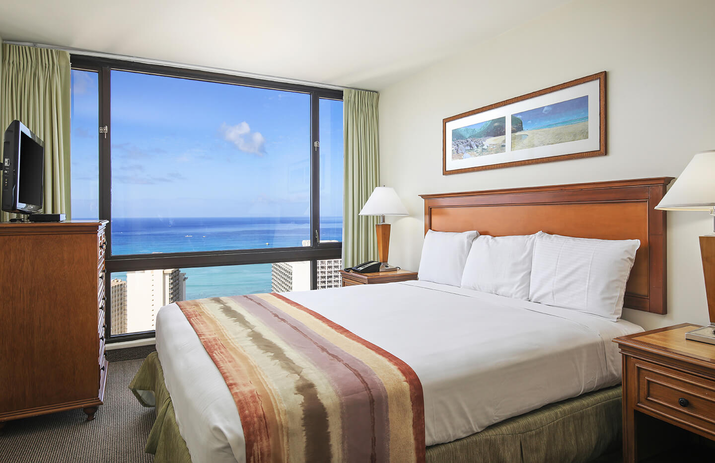 One-Bedroom Deluxe Ocean View Bedroom.