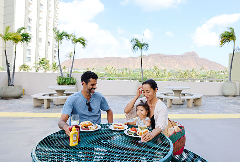Family enjoying meal on recreation deck.