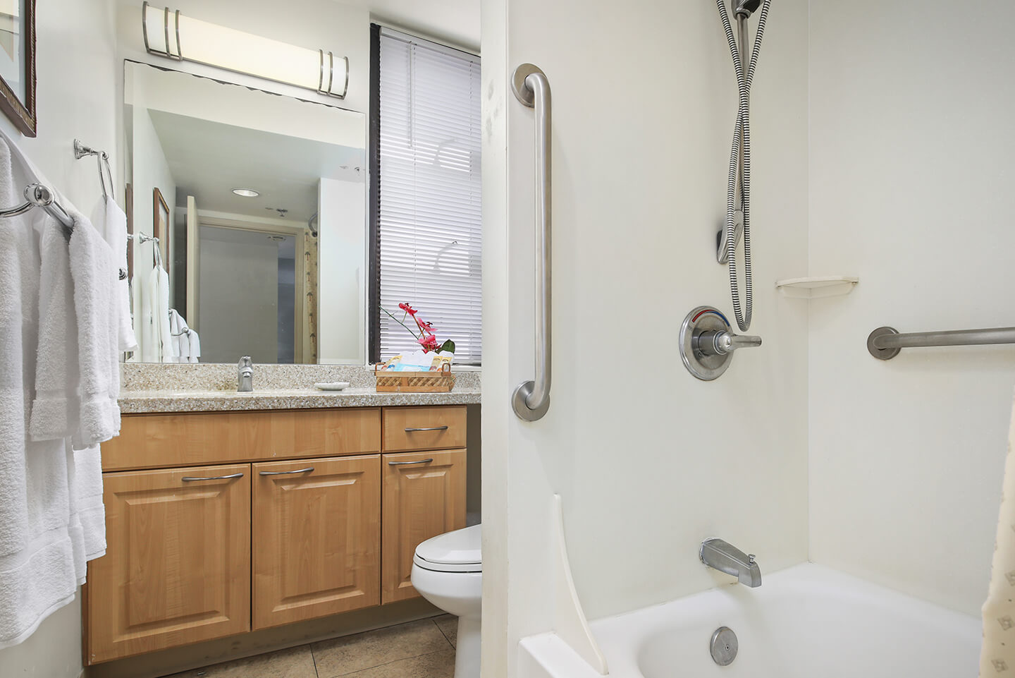Bathroom with a sink, toilet, shower and tub.