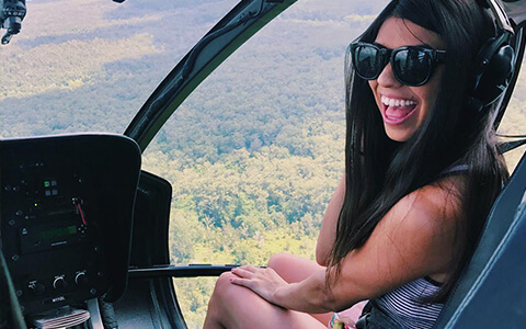 Woman inside of a helicopter