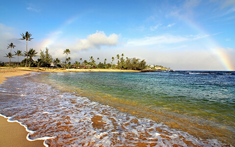 Aerial view of beach with rainbow