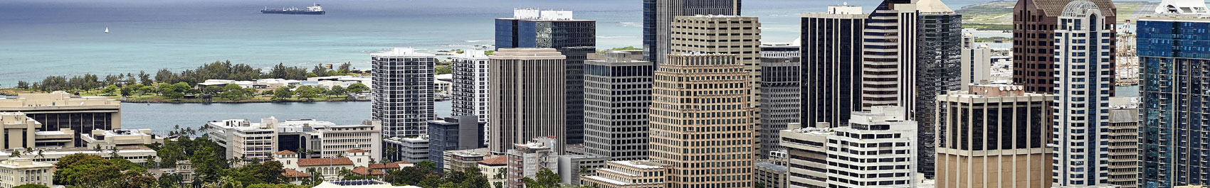Tall buildings with ocean in the background