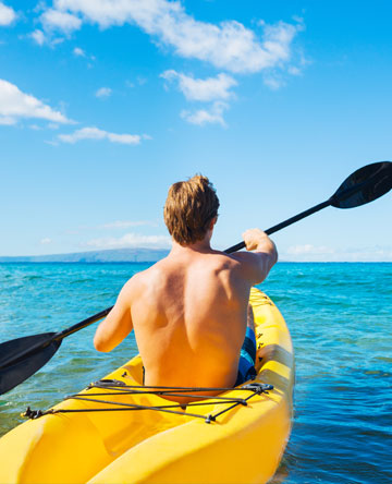 One man kayaking in ocean